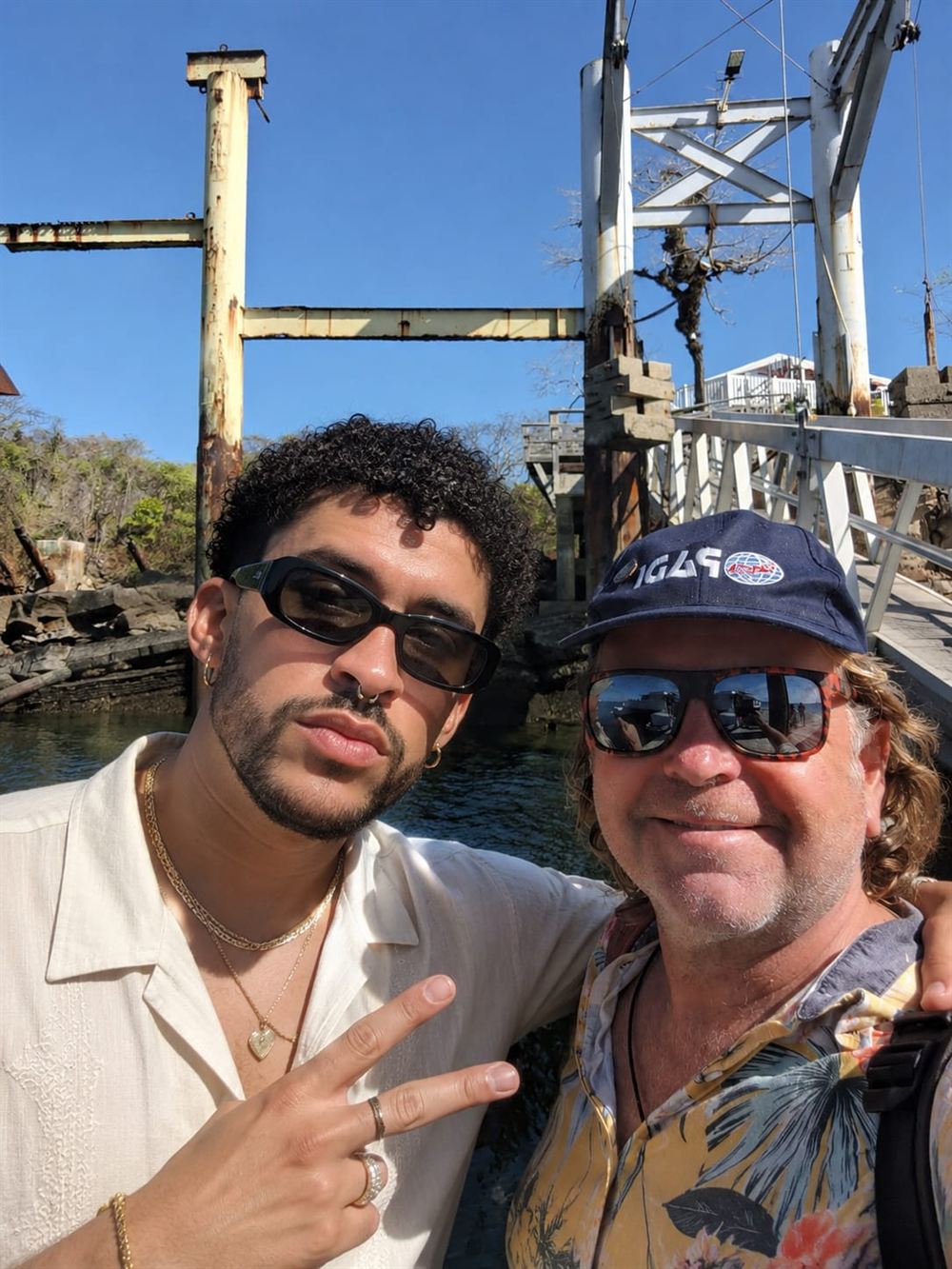 Toby Gough and Bad Bunny on a jetty in the sun